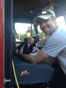 Can Daddy be any prouder? Adam introducing Titus to his first fire truck. (6 days old)